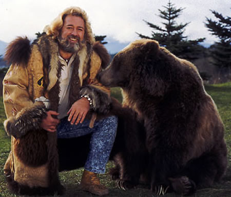 Thick-bearded Grizzly Adams with his bear friend Ben